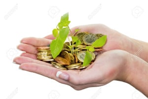 27052860-hands-with-money-and-plant-symbol-photo-surch-for-growing-capital-interest-in-saving--Stock-Photo